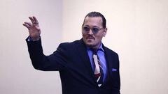 US actor Johnny Depp waves as he departs at the end of the day of a defamation trial at the Fairfax County Circuit Courthouse in Fairfax, Virginia, on May 5, 2022. - Actor Johnny Depp is suing ex-wife Amber Heard for libel after she wrote an op-ed piece in The Washington Post in 2018 referring to herself as a public figure representing domestic abuse. (Photo by JIM LO SCALZO / POOL / POOL / AFP) (Photo by JIM LO SCALZO / POOL/POOL/AFP via Getty Images)