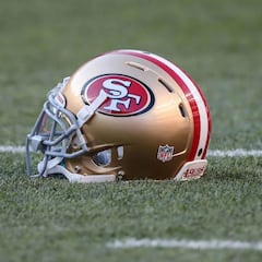 Why do the San Francisco 49ers wear red? What is the origin of their logo?