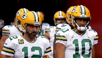 LANDOVER, MARYLAND - OCTOBER 23: Aaron Rodgers #12 of the Green Bay Packers and Jordan Love #10 take the field for warmups before the game against the Washington Commanders at FedExField on October 23, 2022 in Landover, Maryland.   Scott Taetsch/Getty Images/AFP