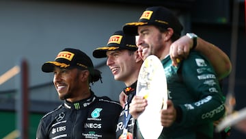 MELBOURNE, AUSTRALIA - APRIL 02: Race winner Max Verstappen of the Netherlands and Oracle Red Bull Racing, Second placed Lewis Hamilton of Great Britain and Mercedes and Third placed Fernando Alonso of Spain and Aston Martin F1 Team celebrate on the podium during the F1 Grand Prix of Australia at Albert Park Grand Prix Circuit on April 02, 2023 in Melbourne, Australia. (Photo by Peter Fox/Getty Images)