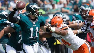 Sep 11, 2016; Philadelphia, PA, USA; Philadelphia Eagles quarterback Carson Wentz (11) throws in front of the pass rush of Cleveland Browns linebacker Nate Orchard (44) during the second quarter at Lincoln Financial Field. Mandatory Credit: Bill Streicher-USA TODAY Sports