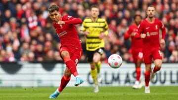 LIVERPOOL, ENGLAND - APRIL 02: Roberto Firmino of Liverpool shoots during the Premier League match between Liverpool and Watford at Anfield on April 02, 2022 in Liverpool, England. (Photo by Clive Brunskill/Getty Images)