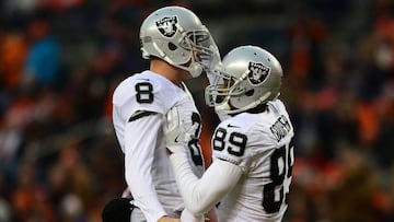 DENVER, CO - JANUARY 1: Wide receiver Amari Cooper #89 of the Oakland Raiders celebrates his touchdown with quarterback Connor Cook #8 in the third quarter of the game against the Denver Broncos at Sports Authority Field at Mile High on January 1, 2017 in Denver, Colorado. Dustin Bradford/Getty Images/AFP
== FOR NEWSPAPERS, INTERNET, TELCOS & TELEVISION USE ONLY ==
