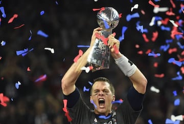 Tom Brady holds the Lombardi Trophy aloft after winning the Super Bowl in 2017.