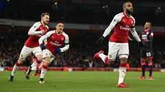 LONDON, ENGLAND - NOVEMBER 29: Alexandre Lacazette of Arsenal celebrates after scoring a goal to make it 1-0 during the Premier League match between Arsenal and Huddersfield Town at Emirates Stadium on November 28, 2017 in London, England. (Photo by Robbi