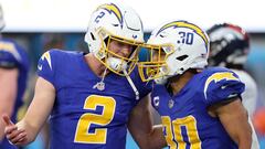 INGLEWOOD, CALIFORNIA - DECEMBER 10: Austin Ekeler #30 of the Los Angeles Chargers and Easton Stick #2 of the Los Angeles Chargers celebrate a touchdown during the fourth quarter against the Denver Broncos at SoFi Stadium on December 10, 2023 in Inglewood, California.   Harry How/Getty Images/AFP (Photo by Harry How / GETTY IMAGES NORTH AMERICA / Getty Images via AFP)