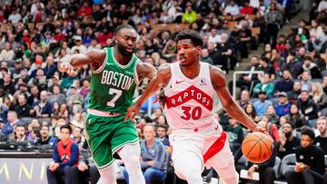 Oct 15, 2024; Toronto, Ontario, CAN; Toronto Raptors guard Ochai Agbaji (30) moves the ball against Boston Celtics guard Jaylen Brown (7) during the second half at Scotiabank Arena. Mandatory Credit: Kevin Sousa-Imagn Images