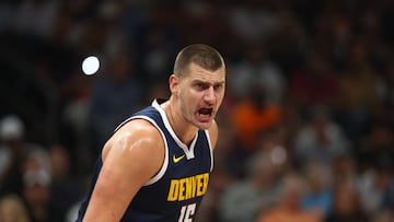 Oct 10, 2023; Phoenix, Arizona, USA; Denver Nuggets center Nikola Jokic (15) reacts against the Phoenix Suns during a preseason game at Footprint Center. Mandatory Credit: Mark J. Rebilas-USA TODAY Sports