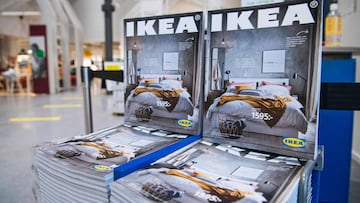 Catalogues are placed for people to take at the entrance to one of the stores of the Swedish furniture giant Ikea on December 7, 2020 in Jarfalla, near Stockholm. - Swedish furniture giant Ikea said Monday, December 7, 2020 it would stop printing its famed physical catalogue, printed yearly in tens of millions of copies, after 70 years, as customers move to digital alternatives. (Photo by Jonathan NACKSTRAND / AFP)