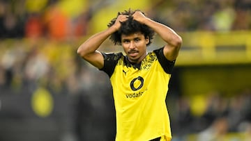 Dortmund's German forward #27 Karim Adeyemi reacts during the German first division Bundesliga football match between Borussia Dortmund and VfL Wolfsburg in Dortmund on September 21, 2025. (Photo by INA FASSBENDER / AFP) / DFL REGULATIONS PROHIBIT ANY USE OF PHOTOGRAPHS AS IMAGE SEQUENCES AND/OR QUASI-VIDEO
