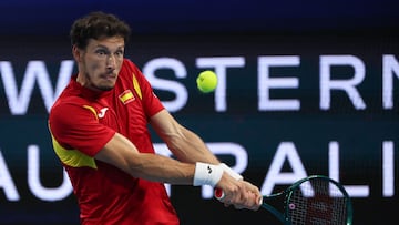 Spain�s Pablo Carreno Busta hits a return against Greece�s Stefanos Tsitsipas during their men's single match at the United Cup tennis tournament in Perth on December 28, 2024. (Photo by COLIN MURTY / AFP) / -- IMAGE RESTRICTED TO EDITORIAL USE - STRICTLY NO COMMERCIAL USE --