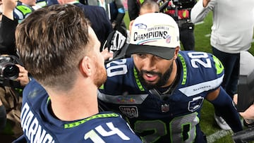 Seattle Seahawks� quarterback #14 Sam Darnold and Seattle Seahawks� safety #20 Julian Love celebrate on th efield after defeating the New England Patriots during Super Bowl LX at Levi's Stadium in Santa Clara, California on February 8, 2026. (Photo by JOSH EDELSON / AFP)