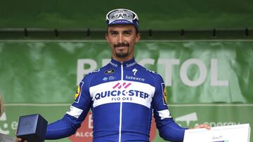 Quick Step Floor's Julian Alaphilippe celebrates on the podium after winning stage three of the Ovo Energy Tour of Britain 2018 in Bristol, Britain, Tuesday, Sept. 4, 2018. (David Davies/PA via AP)