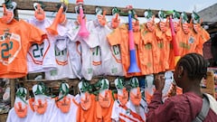 A shopkeeper waits for costumer while selling Ivory Coast national team football kits ahead of the 2024 Africa Cup of Nations