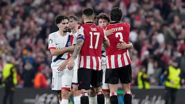 Paris Saint-Germain's Portuguese midfielder #17 Vitinha greets Athletic Bilbao's Spanish defender #17 Yuri Berchiche at the end of the UEFA Champions League league phase day 6 football match between Athletic Club Bilbao and Paris Saint-Germain (PSG) at San Mames Stadium in Bilbao on December 10, 2025. The match ended in a draw 0-0. (Photo by Cesar MANSO / AFP)