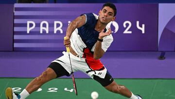 Mexico's Luis Ramon Garrido plays a shot against Taiwan's Chou Tien-chen in the men's singles badminton group stage match during the Paris 2024 Olympic Games at Porte de la Chapelle Arena in Paris on July 28, 2024. (Photo by Arun SANKAR / AFP)