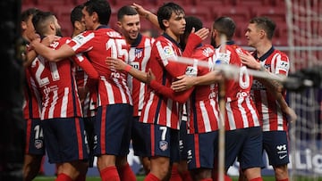 Atletico Madrid's players celebrate their second goal scored by Uruguayan forward Luis Suarez during the Spanish league football match between Club Atletico de Madrid and Elche CF at the Wanda Metropolitano stadium in Madrid on December 19, 2020. (Ph