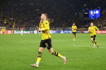 Dortmund's Marco Reus celebrates after scoring against PSV in the UEFA Champions League.