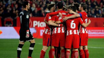 Soccer Football - La Liga Santander - Sevilla vs Atletico Madrid - Ramon Sanchez Pizjuan, Seville, Spain - February 25, 2018 Atletico Madrid players celebrate after Antoine Griezmann scores their third goal from the penalty spot REUTERS/Jon Nazca