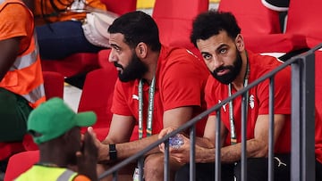 Egypt's forward #10 Mohamed Salah (R) looks on as he attends the Africa Cup of Nations (CAN) 2024 group A football match between Guinea-Bissau and Nigeria at the Felix Houphouet-Boigny Stadium in Abidjan on January 22, 2024. (Photo by FRANCK FIFE / AFP)