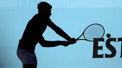 The silhouette of Spain's Carlos Alcaraz returning the ball during a training session before the 2024 ATP Tour Madrid Open tennis tournament is pictured at Caja Magica in Madrid on April 23, 2024. (Photo by Thomas COEX / AFP)