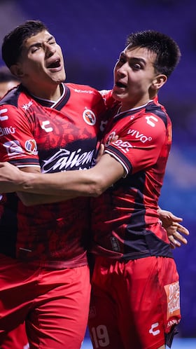 Kevin Castaneda celebrates his goal 0-1 with Gilberto Mora of Tijuana during the 13th round match between Puebla and Tijuana as part of the Liga BBVA MX, Torneo Apertura 2025 at Cuauhtemoc Stadium, on October 17, 2025 in Puebla, Mexico.