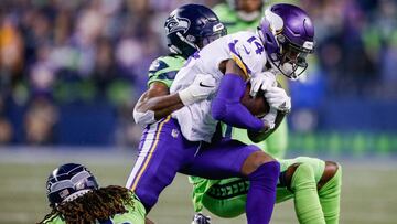 SEATTLE, WA - DECEMBER 10: Stefon Diggs #14 of the Minnesota Vikings tries to fight through a tackle by Tre Flowers #37 and Shaquill Griffin #26 of the Seattle Seahawks at CenturyLink Field on December 10, 2018 in Seattle, Washington.   Otto Greule Jr/Get