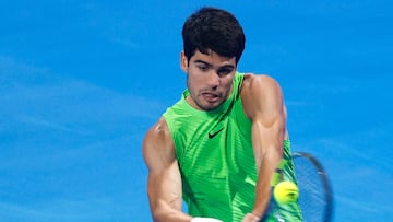 Spain's Carlos Alcaraz hits a return against France's Valentin Royer during their men�s singles match at the Qatar Open tennis tournament in Doha on February 18, 2026. (Photo by Karim JAAFAR / AFP)