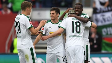 (L-R) Moenchengladbach's defender Matthias Ginter, Moenchengladbach's midfielder Jonas Hofmann, Moenchengladbach's Swiss striker Josip Drmic and Moenchengladbach's Swiss midfielder Denis Zakaria react after the fourth goal for their team during the German first division Bundesliga football match 1. FC Nuremberg vs Borussia Moenchengaldbach in the stadium in Nuremberg, southern Germany, on May 11, 2019. (Photo by Christof STACHE / AFP) / DFL REGULATIONS PROHIBIT ANY USE OF PHOTOGRAPHS AS IMAGE SEQUENCES AND/OR QUASI-VIDEO