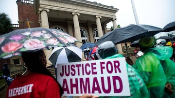 Demonstrators gather at the Glynn County courthouse during a court appearance by Gregory and Travis McMichael, two suspects in the fatal shooting of Ahmaud Arbery, on June 4, 2020 in Brunswick, Georgia. 