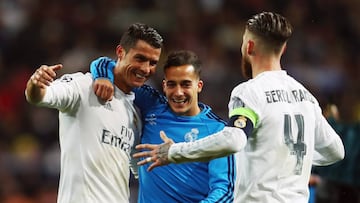 Cristiano of Real Madrid celebrates with team mates Lucas Vazquez and Sergio Ramos after the UEFA Champions league Quarter Final Second Leg match between Real Madrid and VfL Wolfsburg.