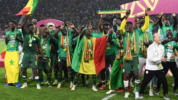 Senegal's players celebrate after winning the Africa Cup of Nations (CAN) 2021 final football match between Senegal and Egypt at Stade d'Olembe in Yaounde on February 6, 2022.
