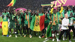 Senegal's players celebrate after winning the Africa Cup of Nations (CAN) 2021 final football match between Senegal and Egypt at Stade d'Olembe in Yaounde on February 6, 2022.