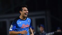 Napoli's Mexican forward Hirving Lozano (C) celebrates scoring his team's first goal during the UEFA Champions League Group A football match between SSC Napoli and Ajax Amsterdam at the Diego Armando Maradona Stadium in Naples on October 12, 2022. (Photo by Filippo MONTEFORTE / AFP)