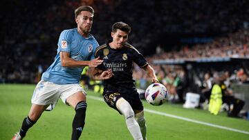 Celta Vigo's Spanish defender #03 Oscar Mingueza vies with Real Madrid's Spanish defender #20 Fran Garcia during the Spanish Liga football match between RC Celta de Vigo and Real Madrid CF at the Balaidos stadium in Vigo on August 25, 2023. (Photo by MIGUEL RIOPA / AFP)