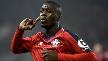 Lille&#039;s Ivorian forward Nicolas Pepe celebrates after scoring a goal during the French L1 football match between Lille (LOSC) and Olympique Lyonnais (OL) on December 1, 2018 at the Pierre Mauroy Stadium in Villenueve d&#039;Ascq. (Photo by FRANCOIS L