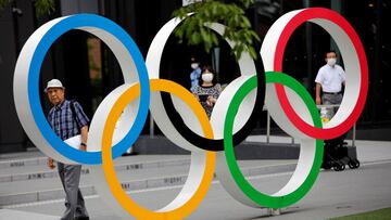 Kohei Jinno, 87, who was forced to leave his house two times ahead of the 1964 and 2020 Olympics Games to make way for construction of the main stadium, walks next to the Olympic Rings monument outside the Japan Olympic Museum near the National Stadium, t