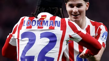 Atletico Madrid's English forward #22 Ademola Lookman celebrates with Atletico Madrid's Argentine forward #19 Julian Alvarez after scoring his team's third goal during the Spanish Copa del Rey (King's Cup) semi final first leg football match between Club Atletico de Madrid and FC Barcelona at Metropolitano Stadium in Madrid on February 12, 2026. (Photo by Oscar DEL POZO / AFP)