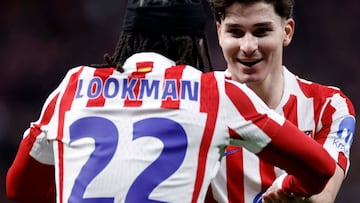 Atletico Madrid's English forward #22 Ademola Lookman celebrates with Atletico Madrid's Argentine forward #19 Julian Alvarez after scoring his team's third goal during the Spanish Copa del Rey (King's Cup) semi final first leg football match between Club Atletico de Madrid and FC Barcelona at Metropolitano Stadium in Madrid on February 12, 2026. (Photo by Oscar DEL POZO / AFP)