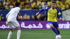 Nassr's Portuguese forward Cristiano Ronaldo (R) i smarked by Batin's Saudi midfielder Yousef al-Shammari during the Saudi Pro League football match between Al-Nassr and Al-Batin at the Mrsool Park Stadium in the Saudi capital Riyadh on March 3, 2023. (Photo by AFP)