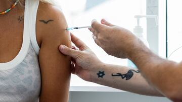 FILE PHOTO: An Israeli woman receives a third shot of coronavirus disease (COVID-19) vaccine in Tel Aviv, Israel August 30, 2021. REUTERS/Amir Cohen/File Photo