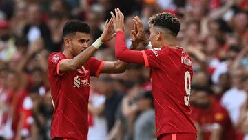 Liverpool's Colombian midfielder Luis Diaz (L) leaves the picth as Liverpool's Brazilian midfielder Roberto Firmino (R) enters during the English FA Cup final football match between Chelsea and Liverpool, at Wembley stadium, in London, on May 14, 2022. (Photo by Glyn KIRK / AFP) / NOT FOR MARKETING OR ADVERTISING USE / RESTRICTED TO EDITORIAL USE