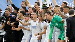 Soccer Football - LaLiga - Real Madrid v Espanyol - Santiago Bernabeu, Madrid, Spain - April 30, 2022 Real Madrid's Marcelo holds the trophy and celebrates with team members after winning LaLiga REUTERS/Juan Medina