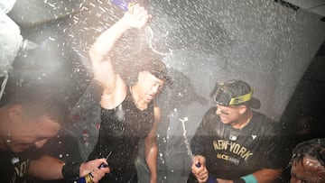 Oct 10, 2024; Kansas City, Missouri, USA; New York Yankees designated hitter Giancarlo Stanton (27), outfielder Aaron Judge (99) and third baseman Jazz Chisholm Jr. (13) spray champagne as the New York Yankees celebrate a win over the Kansas City Royals during game four of the ALDS for the 2024 MLB Playoffs at Kauffman Stadium. Mandatory Credit: Jay Biggerstaff-Imagn Images