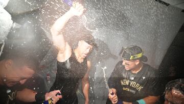 Oct 10, 2024; Kansas City, Missouri, USA; New York Yankees designated hitter Giancarlo Stanton (27), outfielder Aaron Judge (99) and third baseman Jazz Chisholm Jr. (13) spray champagne as the New York Yankees celebrate a win over the Kansas City Royals during game four of the ALDS for the 2024 MLB Playoffs at Kauffman Stadium. Mandatory Credit: Jay Biggerstaff-Imagn Images