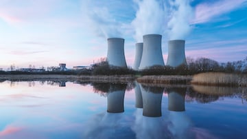 Nuclear power plant after sunset. Dusk landscape with big chimneys.