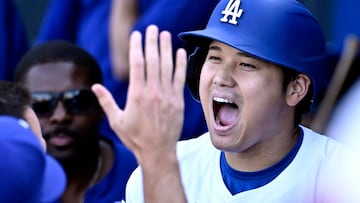 LOS ANGELES, CALIFORNIA - SEPTEMBER 22: Shohei Ohtani #17 of the Los Angeles Dodgers is congratulated after hitting a game tying home run in the ninth inning against the Colorado Rockies at Dodger Stadium on September 22, 2024 in Los Angeles, California. John McCoy/Getty Images/AFP (Photo by John MCCOY / GETTY IMAGES NORTH AMERICA / Getty Images via AFP)