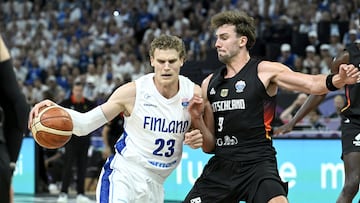 Finland's Lauri Markkanen in action with Germany's Franz Wagner.