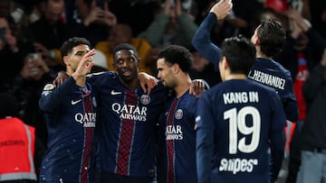 Paris Saint-Germain's French forward #10 Ousmane Dembele (C) celebrates with teammates after scoring his team's first goal during the French L1 football match between Paris Saint-Germain (PSG) and Toulouse FC at the Parc des Princes stadium in Paris on April 3, 2026. (Photo by Anne-Christine POUJOULAT / AFP)