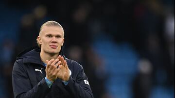 Manchester City's Norwegian striker Erling Haaland applauds at the end of the English Premier League football match between Manchester City and Wolverhampton Wanderers at the Etihad Stadium in Manchester, north west England, on January 22, 2023. - Manchester City won 3 - 0 against Wolverhampton Wanderers. (Photo by Paul ELLIS / AFP) / RESTRICTED TO EDITORIAL USE. No use with unauthorized audio, video, data, fixture lists, club/league logos or 'live' services. Online in-match use limited to 120 images. An additional 40 images may be used in extra time. No video emulation. Social media in-match use limited to 120 images. An additional 40 images may be used in extra time. No use in betting publications, games or single club/league/player publications. /